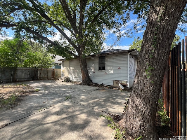 back of property featuring a patio