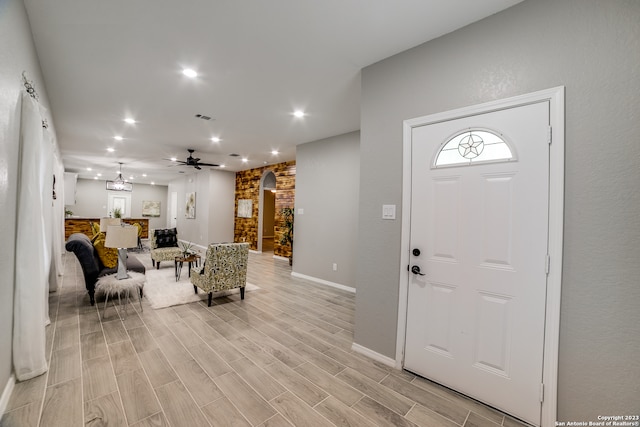 entrance foyer featuring ceiling fan and light wood-type flooring