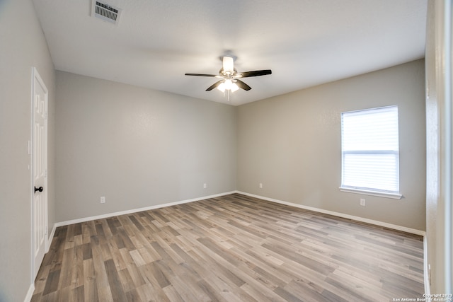 unfurnished room featuring ceiling fan and light hardwood / wood-style floors