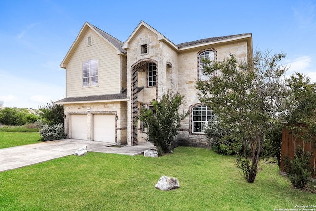 view of front facade with a garage and a front yard