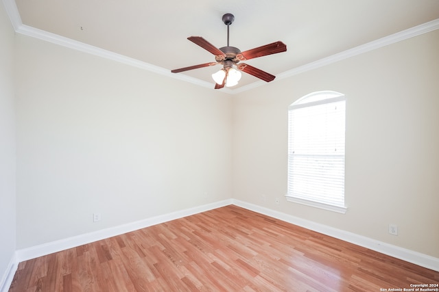 spare room featuring ornamental molding, light hardwood / wood-style flooring, and ceiling fan