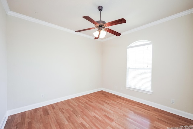 unfurnished room featuring light wood-style flooring, baseboards, and ornamental molding