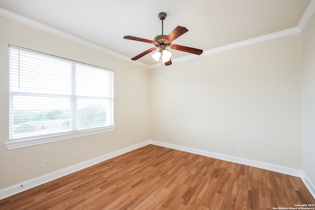 spare room with crown molding, hardwood / wood-style floors, and ceiling fan