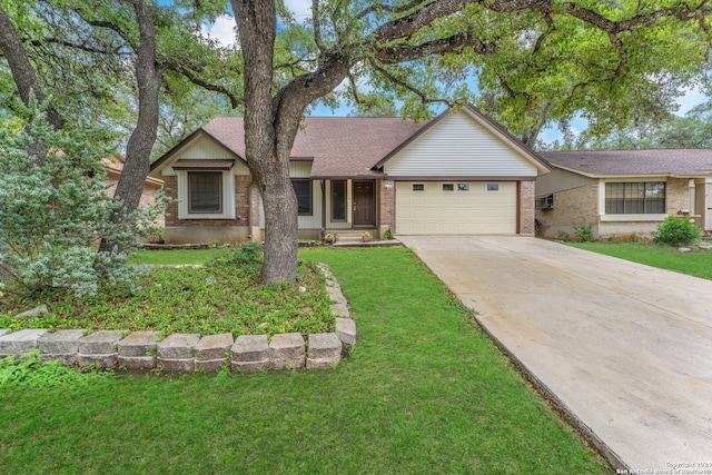 single story home featuring a garage and a front yard