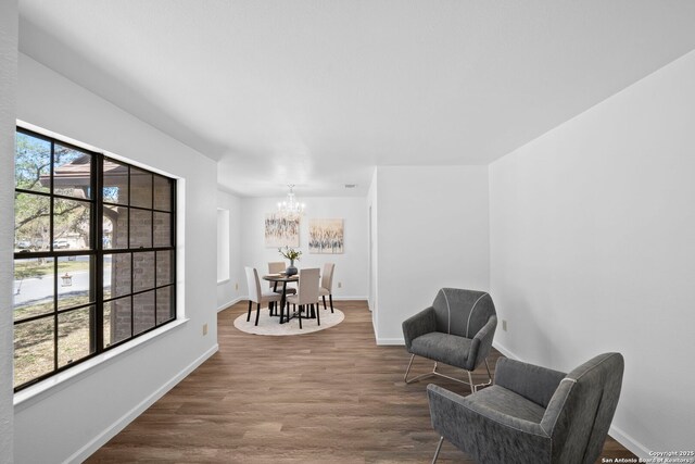 clothes washing area featuring hookup for a washing machine, hookup for an electric dryer, and light hardwood / wood-style floors