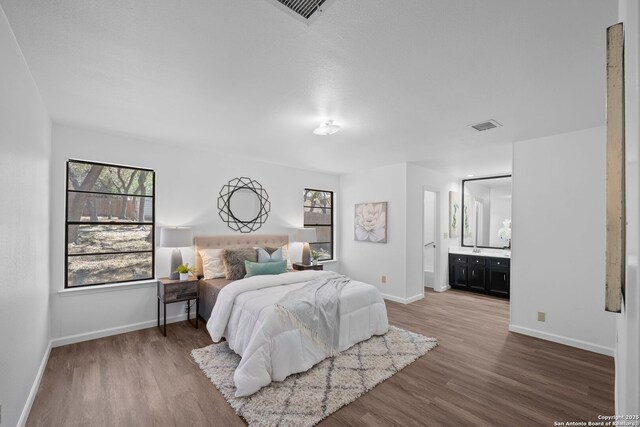 unfurnished living room featuring ceiling fan, vaulted ceiling, hardwood / wood-style flooring, and a fireplace