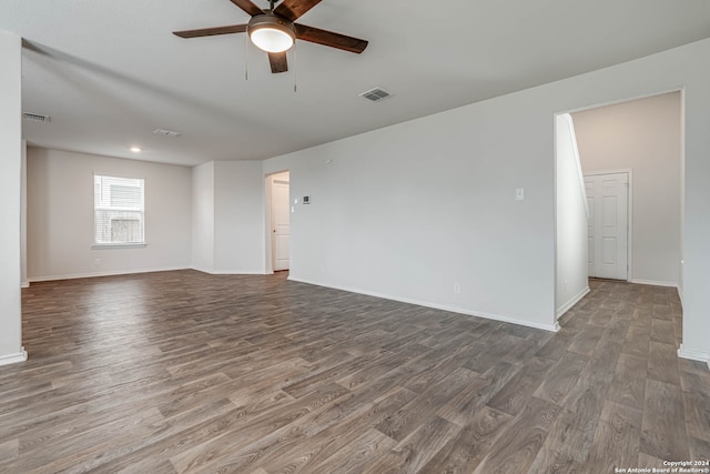 empty room featuring hardwood / wood-style floors and ceiling fan