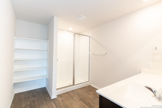 bathroom featuring an enclosed shower, hardwood / wood-style flooring, and vanity