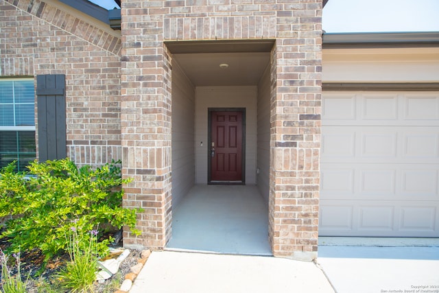 entrance to property featuring a garage