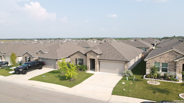 view of front of house featuring a garage and a front yard