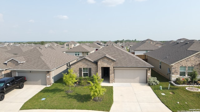 view of front of house with a garage and a front yard