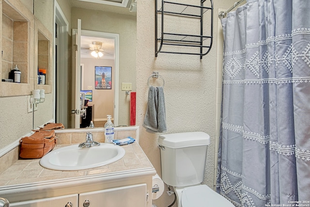 bathroom with vanity, toilet, and a shower with shower curtain