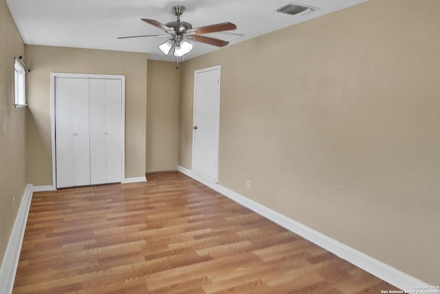 unfurnished bedroom with light wood-type flooring and ceiling fan