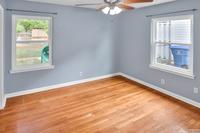 unfurnished room with hardwood / wood-style floors and ceiling fan