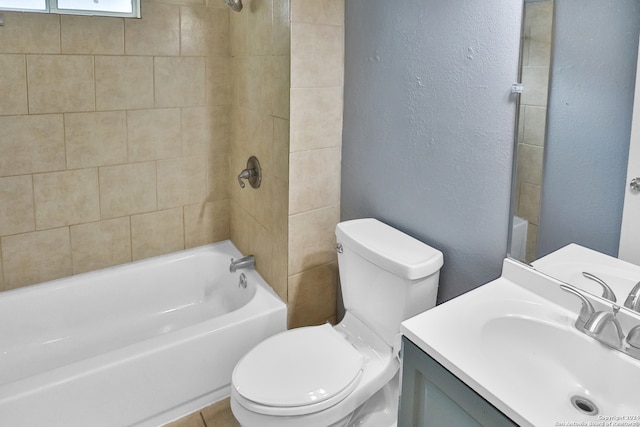 full bathroom featuring vanity, toilet, and tiled shower / bath