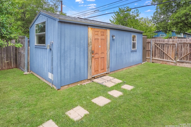 view of outdoor structure with a lawn