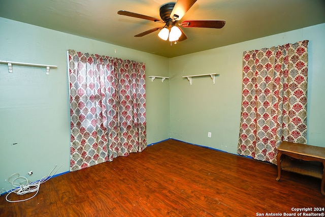 empty room featuring ceiling fan and wood-type flooring