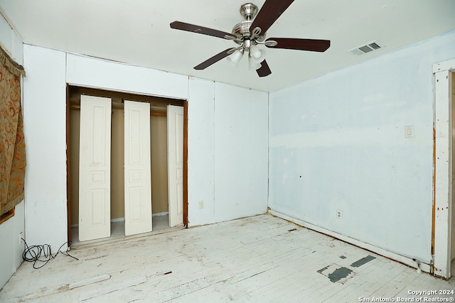 unfurnished bedroom featuring ceiling fan