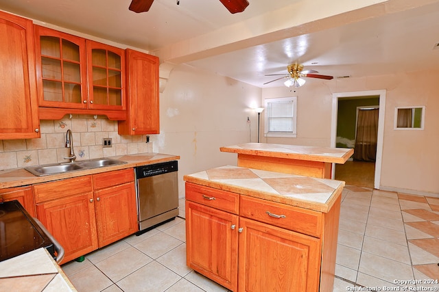 kitchen featuring a center island, ceiling fan, sink, and stainless steel dishwasher