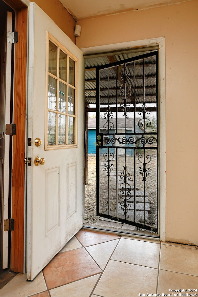 interior space featuring light tile patterned floors