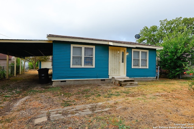 view of front of home featuring a carport