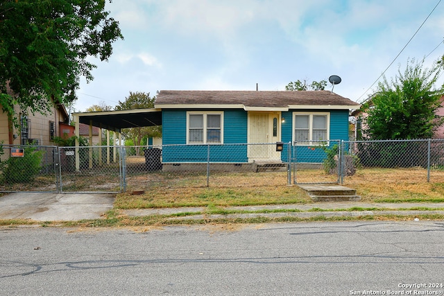 bungalow-style home with a carport