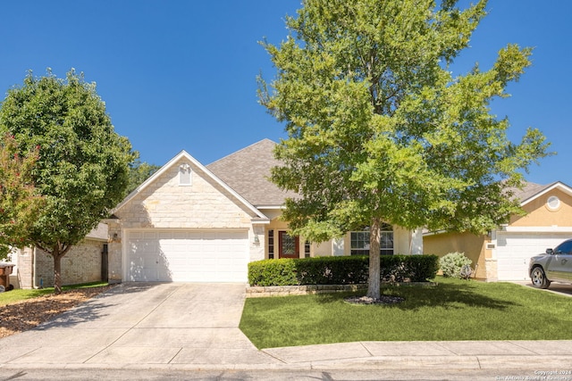 view of front of home with a garage and a front yard