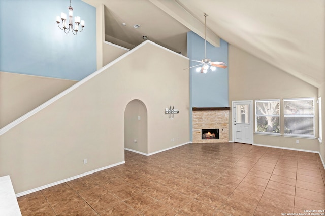 unfurnished living room featuring high vaulted ceiling, tile patterned flooring, ceiling fan with notable chandelier, a stone fireplace, and beam ceiling