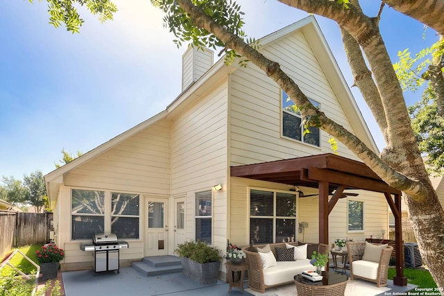 rear view of property with an outdoor hangout area and a patio area