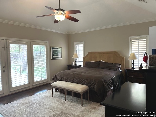 bedroom featuring ceiling fan, ornamental molding, hardwood / wood-style floors, and vaulted ceiling