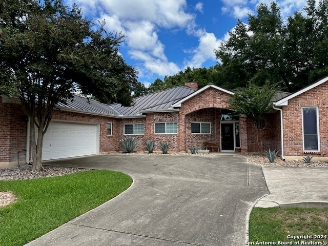 single story home featuring a garage