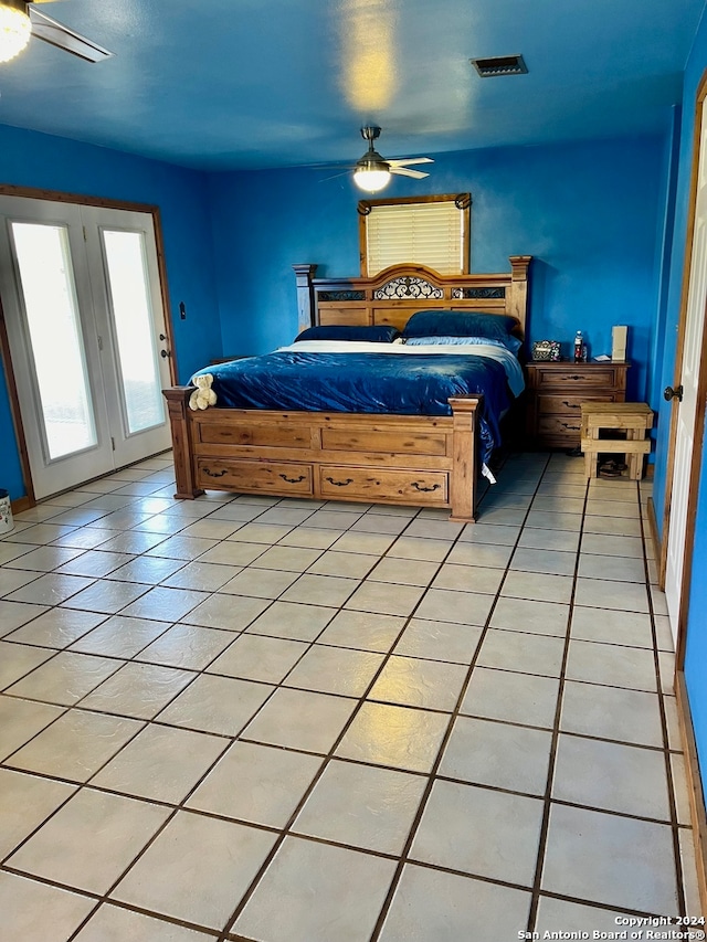 bedroom featuring light tile patterned floors and ceiling fan