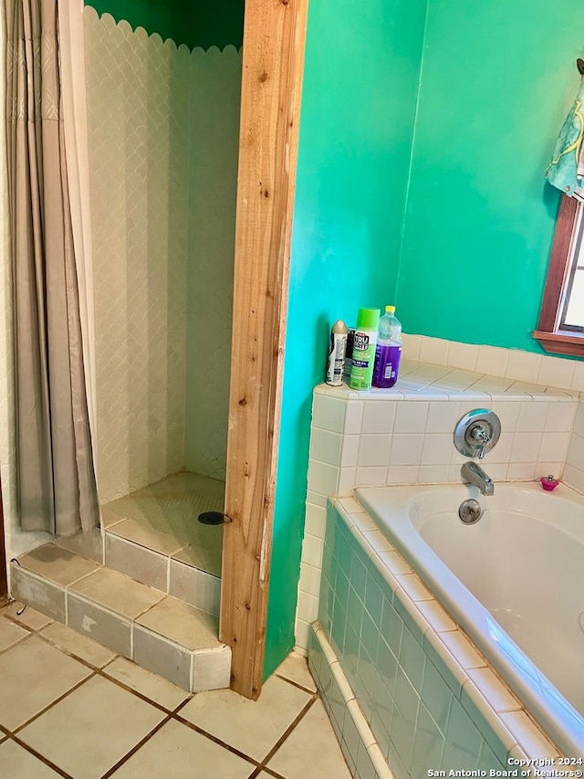 bathroom featuring independent shower and bath and tile patterned flooring