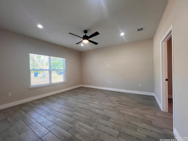 unfurnished room featuring ceiling fan and wood-type flooring