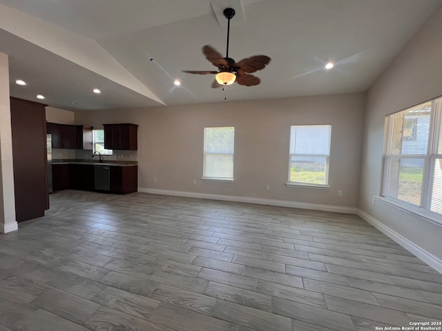 unfurnished living room featuring lofted ceiling, ceiling fan, and light hardwood / wood-style floors