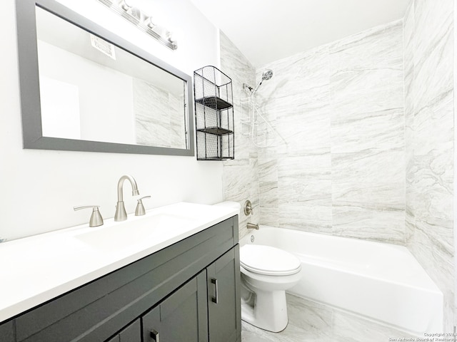 full bathroom featuring vanity, toilet, and tiled shower / bath combo