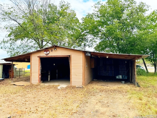 garage featuring a carport