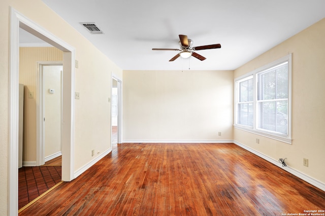 empty room featuring ceiling fan and wood-type flooring