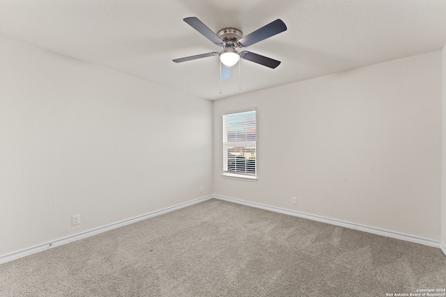 carpeted empty room with ceiling fan