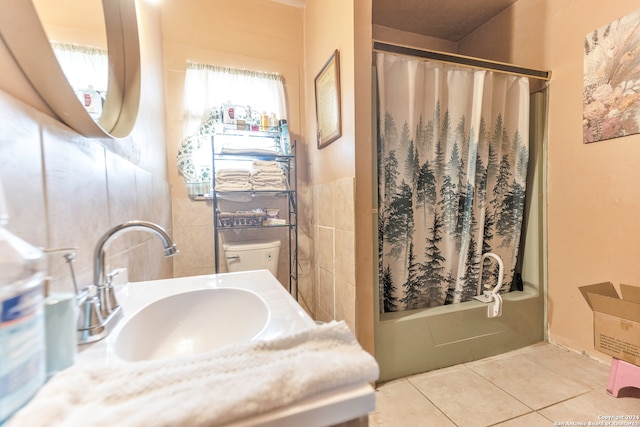 full bathroom with vanity, toilet, tile patterned floors, and shower / bathtub combination with curtain