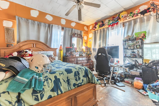 bedroom with concrete floors and ceiling fan