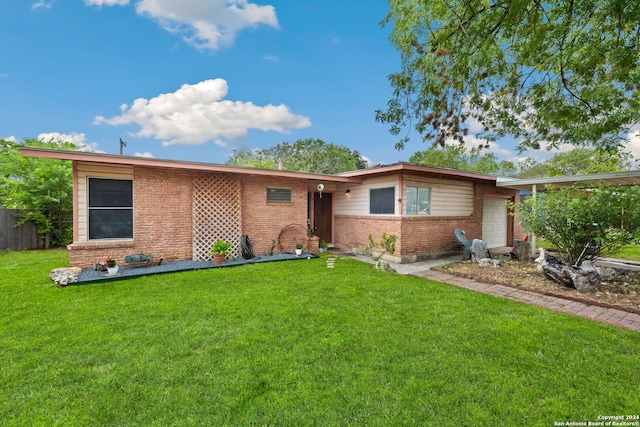 ranch-style house featuring a garage, brick siding, and a front lawn