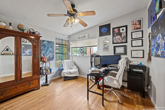 office space featuring vaulted ceiling, ceiling fan, a textured ceiling, and hardwood / wood-style flooring