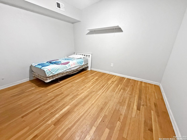 unfurnished bedroom with wood-type flooring