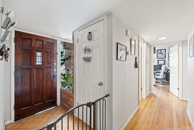 entryway featuring a textured ceiling