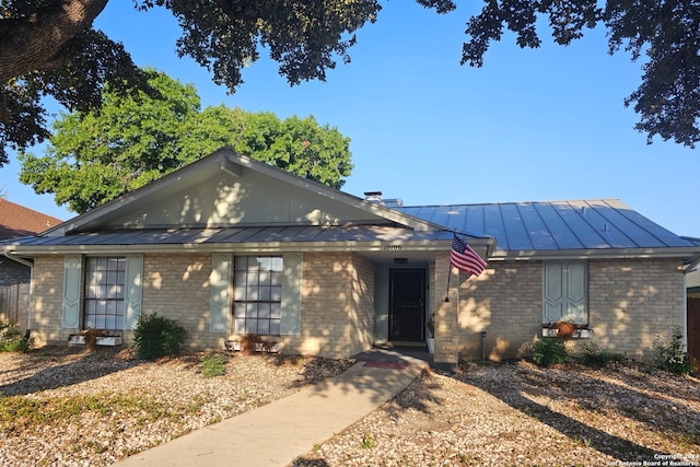 ranch-style house with solar panels