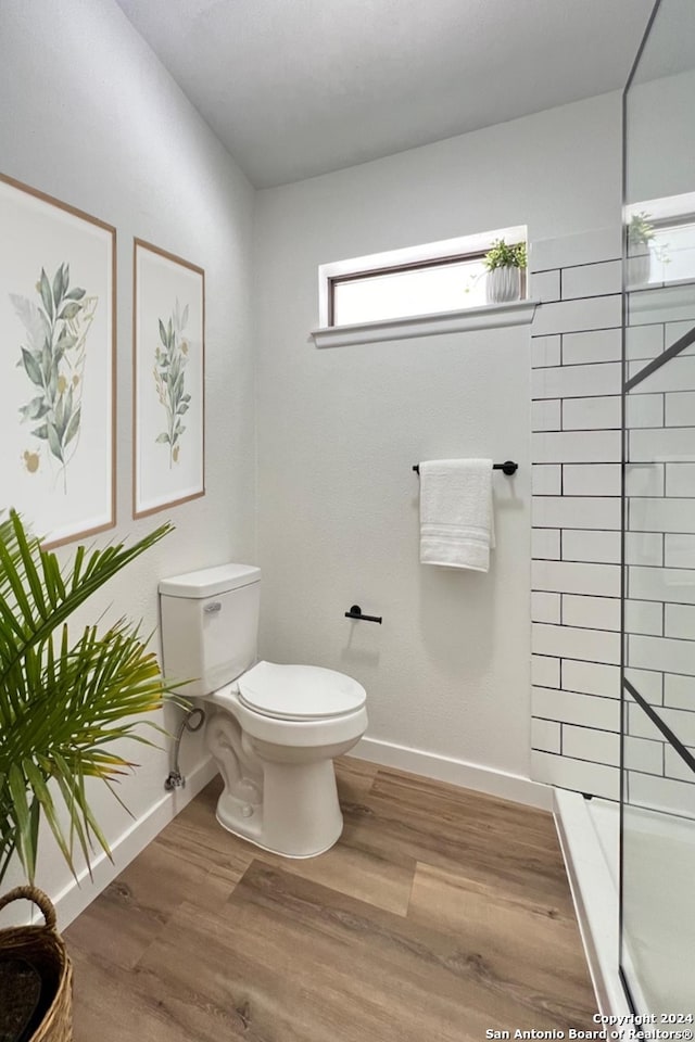 bathroom featuring hardwood / wood-style floors and toilet