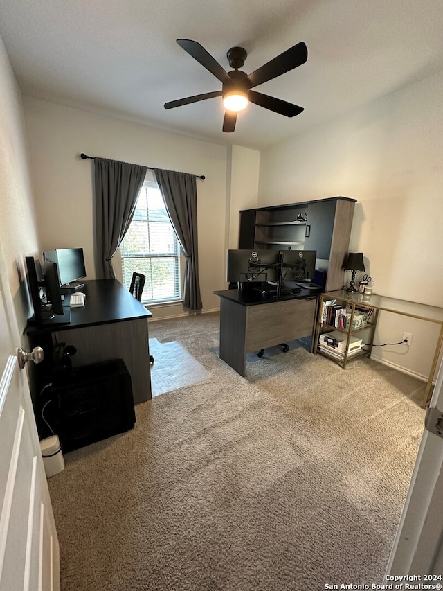 office area featuring light colored carpet and ceiling fan