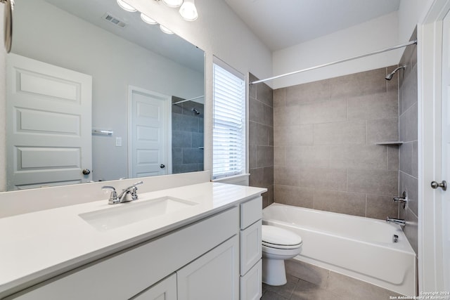 bathroom featuring tile patterned floors, visible vents, toilet, shower / tub combination, and vanity