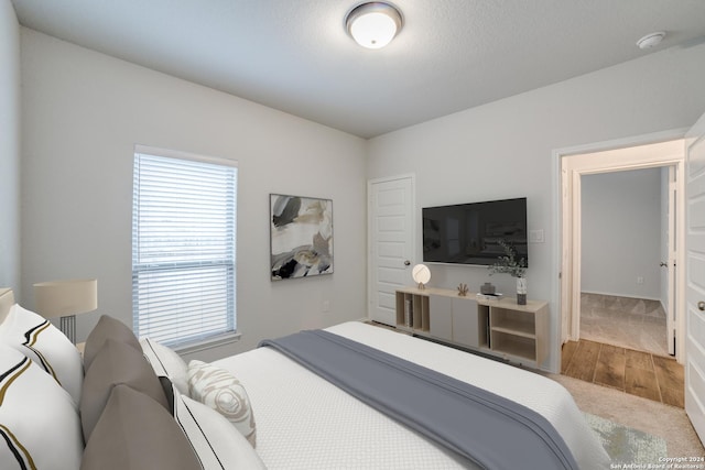 bedroom with wood finished floors